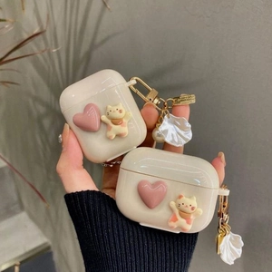 Cute cat heart AirPods case in creamy white silicone with pearl and shell charms