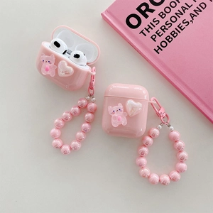 Pink AirPods case with cute cat charm and pearly heart wrist strap keychain