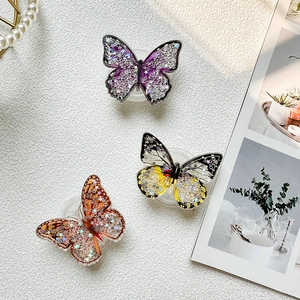 Collapsible butterfly phone sockets with glitter stars and colorful quicksand design