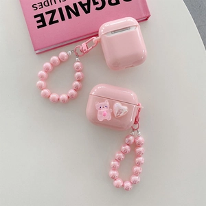 Pink heart and cat bead strap details on a polished protective case for AirPods Pro