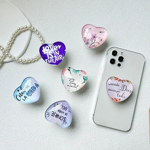 Set of six heart-shaped acrylic phone sockets with floral patterns and motivational text