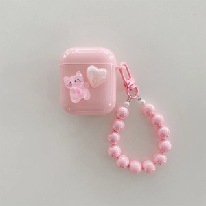 Detailed view of pink AirPods case with cute cat charm and gradient beaded hand strap