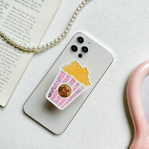Creative popcorn liquid quicksand phone socket holder with glitter on a white smartphone