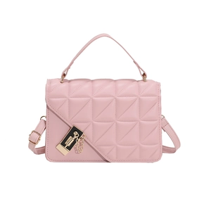 Detail of pink quilted handbag with triangular pattern and gold metal lock closure