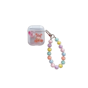 Transparent AirPods case with pink bear, heart detail and colorful beaded hand strap