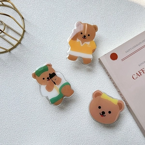 Detailed close-up of cute acrylic bear phone stands in various Korean style designs