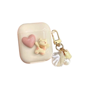 Cute white AirPods case featuring a 3D cat doll, pink heart, and pearl shell pendant