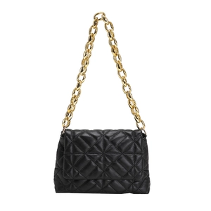 Detail of black quilted PU leather shoulder bag with bold gold acrylic chain strap