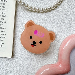 Detail of cute bear acrylic phone grip with smooth edges and vibrant glossy finish