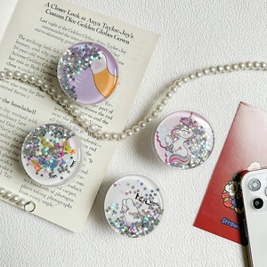 Detail of round glitter unicorn phone grips with flowing star sequins and cute cat paw