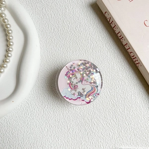 Detail of round phone socket with unicorn cartoon and glitter star sequins decoration