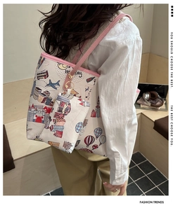 Detail of cartoon tote bag with city illustration and matching mini pouch accessory