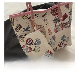 Detail of white tote bag with Hong Kong city illustrations and matching small pouch