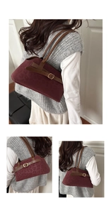 Detail view of burgundy leopard print suede handbag with premium brown leather straps