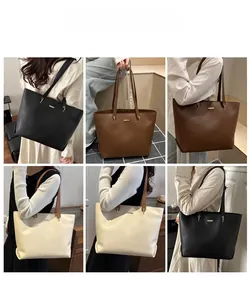 Detail shot of multi-color leather tote bags showing fine texture and golden metal logo