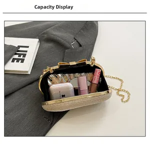 Detail showing internal capacity of gold glitter evening clutch with lipstick and cosmetics