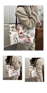Detail of printed tote bag with cartoon city landmarks and matching mini coin purse