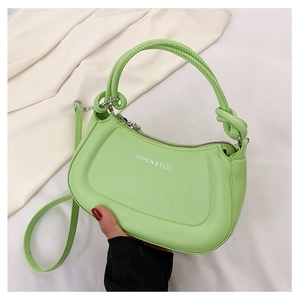 Detail of light green crescent handbag with knot handle and adjustable strap