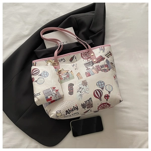 Close-up of retro tote bag set with Hong Kong city prints and pink leather trim details