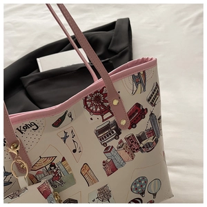 Detail showing the pink handles and colorful Hong Kong theme city illustration on the tote bag