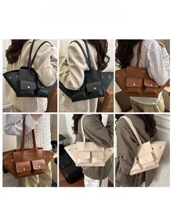 Detail view of large lychee texture faux leather tote bags in black, caramel, and beige