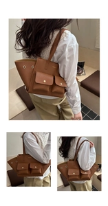 Close-up of brown pebbled leather tote bag featuring golden hardware and side eyelets