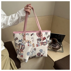Close-up of canvas tote bag with colorful Hong Kong illustration and pink leather handles