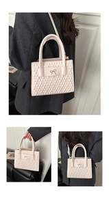 Detail of cream quilted PU leather bag with gold bow clasp and detachable shoulder strap