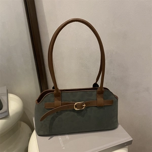 Vintage green suede shoulder bag with brown leather straps and gold buckle detail
