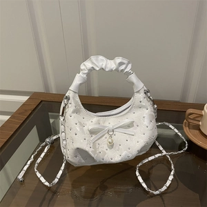 White jacquard crescent handbag with rhinestones, bow accent, and pearl charm detail