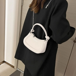 White half-moon crossbody bag with knot handle and silver chain strap for women