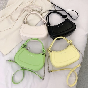 Chic dumpling-shaped half-moon bags in four colors with knot handles and chain straps