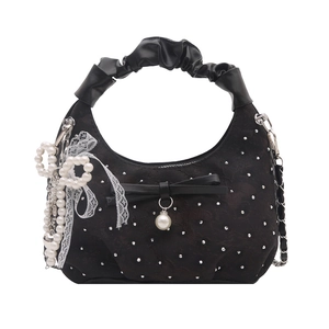 Chic black hobo handbag with bow details, pearls, lace, and stylish scrunchie handle