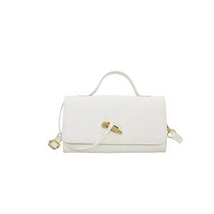 White woven crossbody bag with elegant gold knot clasp and top handle for evening wear