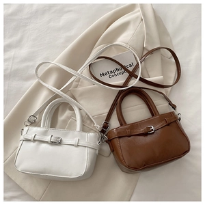 Minimalist mini shoulder bags in white and brown with decorative metal buckle detail