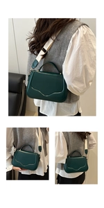 Detail view of dark green crossbody bag with textured curves and cream fabric strap