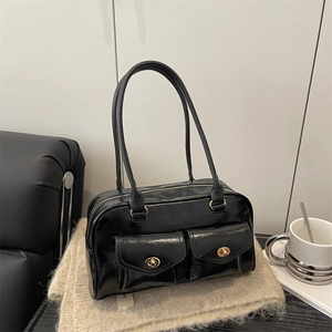 Chic black faux leather underarm bag with double front pockets and gold metal hardware