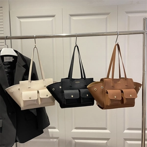 Chic textured leather dumpling tote bag available in cream, black and tan colors