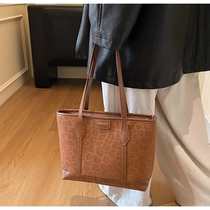 Detailed close-up of brown leopard print tote bag with Fashion & Bags logo accent