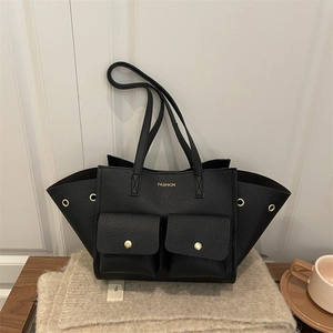 Large black lychee pattern tote bag with dual front pockets and gold fashion lettering