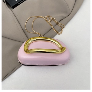 Pink bean-shaped handbag with unique gold streamline handle and snake chain detail