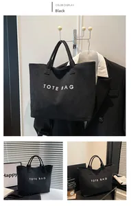 Detail shot of black canvas tote bag with white TOTE BAG text for daily commuting