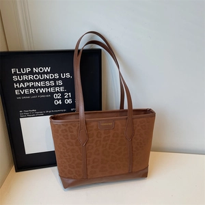 Brown leopard print suede tote bag with leather base and double handles for work