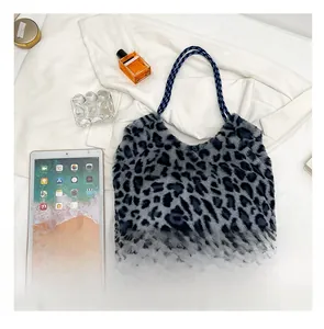 Leopard print faux fur tote bag showing large capacity size comparison with a tablet