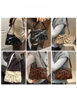 Detail view showing bow accents and star studs on pleated shoulder bags in various colors