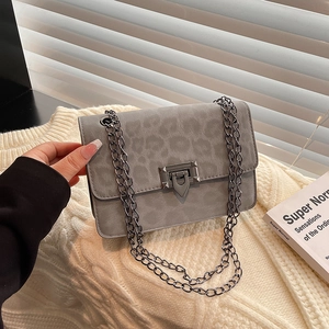 Minimalist grey leopard print crossbody bag with metal chain strap and flap closure