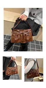 Close-up of dark brown leather handbag featuring a bow tie and star rivets detail