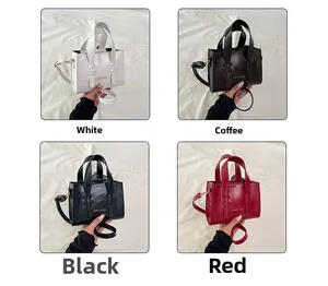 Detailed close-up showing four colors of glossy small square bags with top handles