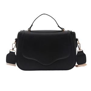 Classic black faux leather saddle bag with top handle and gold-tone hardware