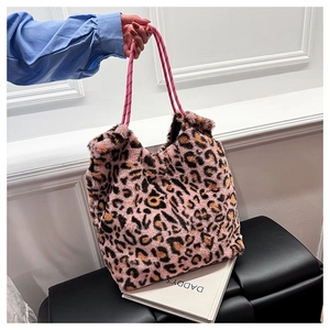Close-up of pink leopard print plush tote bag with thick pink rope handles for women